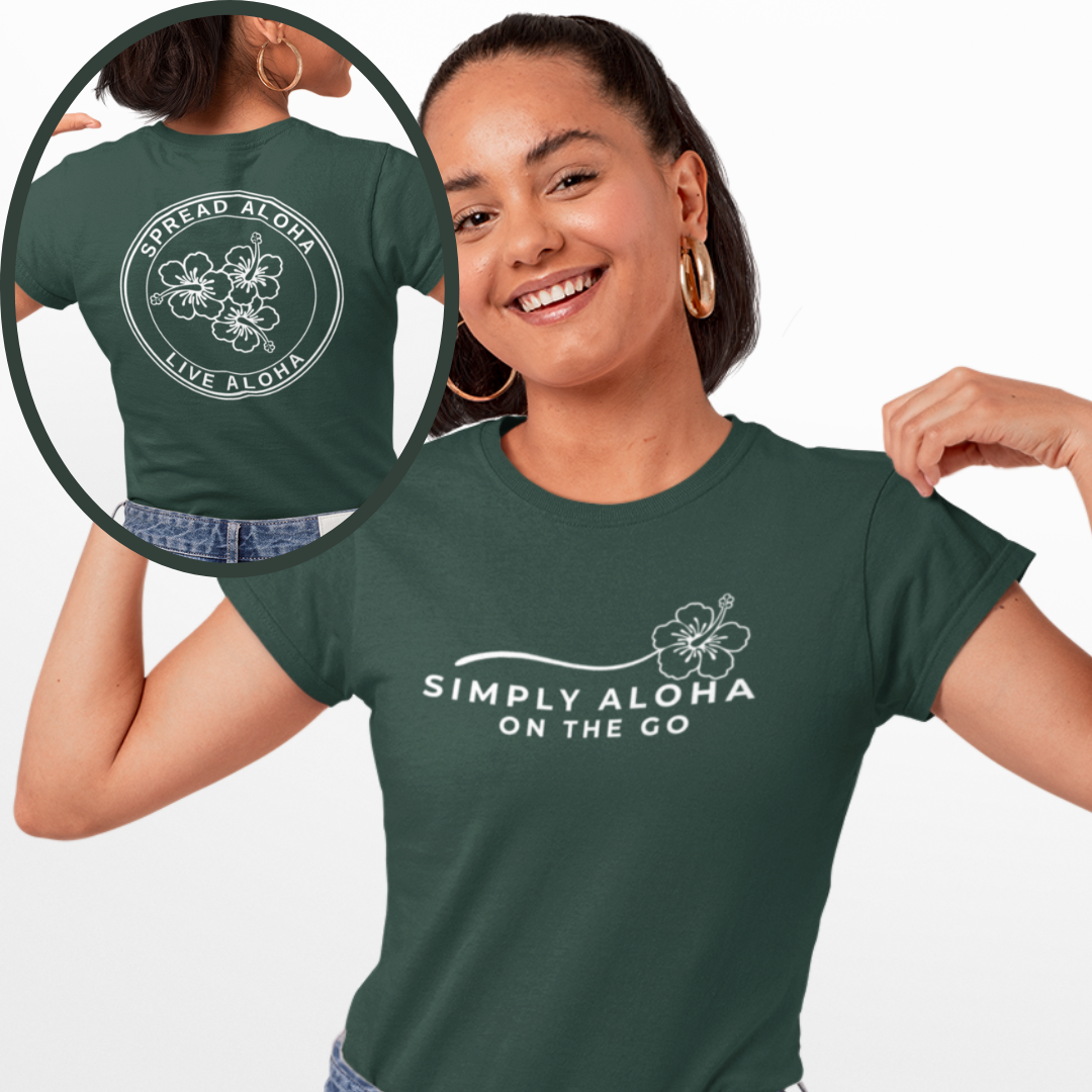A smiling woman showing the front and back of a forest green custom t-shirt with the white hibiscus brand logo reading Simply Aloha On The Go.