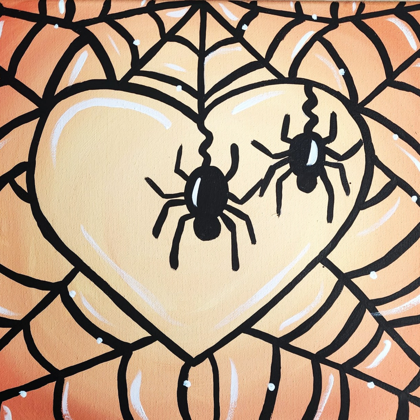 Two black spiders hanging from a web in front of a large, glowing cream-colored heart against an orange background.