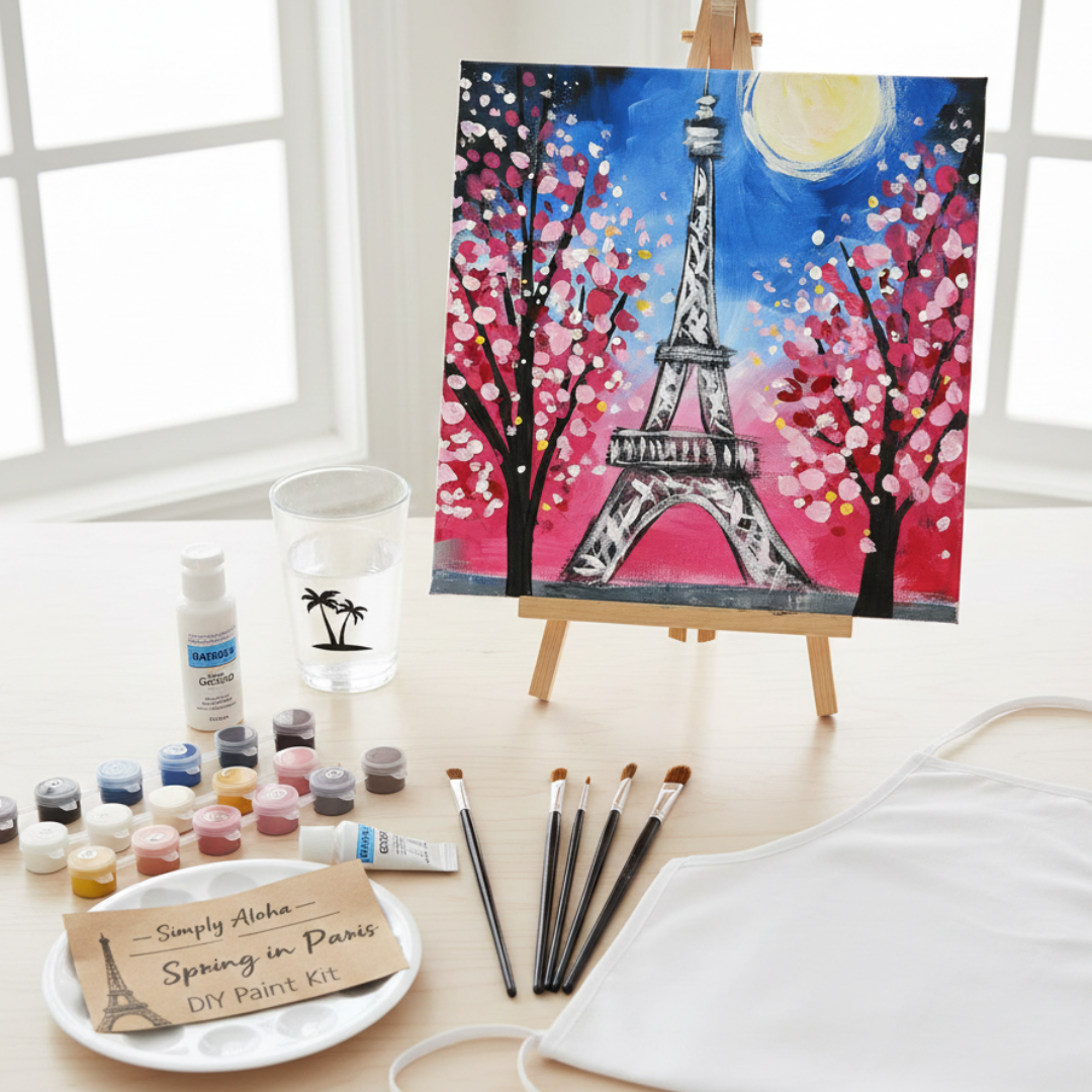 Painting of the Eiffel Tower with cherry blossoms on an easel, surrounded by art supplies.