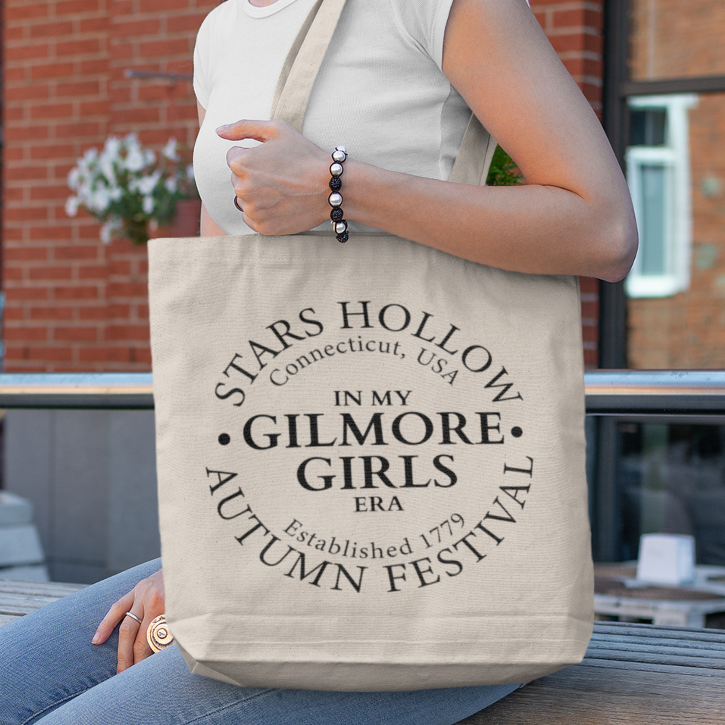 An eco-friendly Stars Hollow inspired tote bag with a graphic design of Luke's Diner, perfect for book and coffee lovers