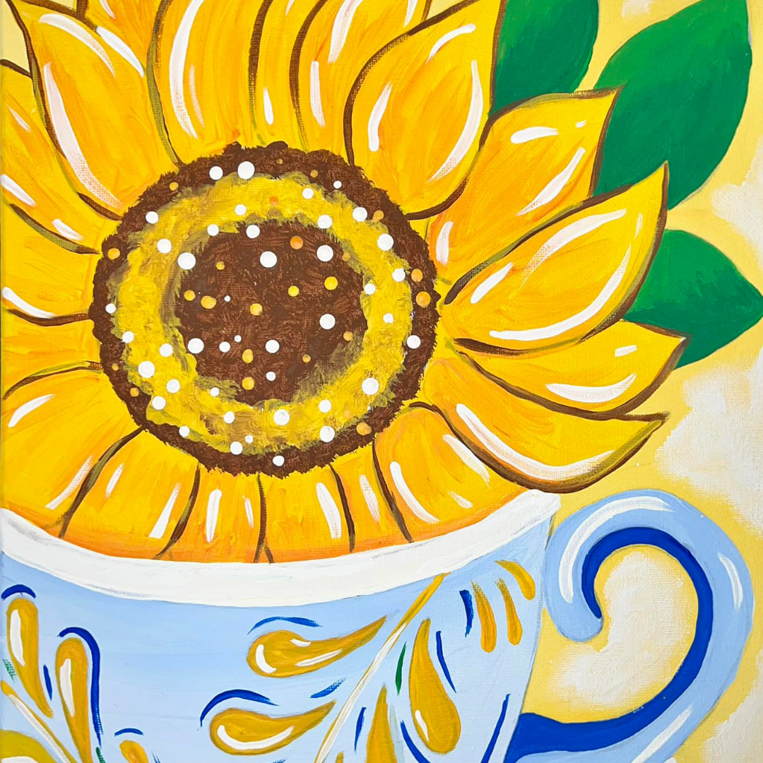 Sunflower painted on a ceramic cup with blue and yellow design, supplies included
