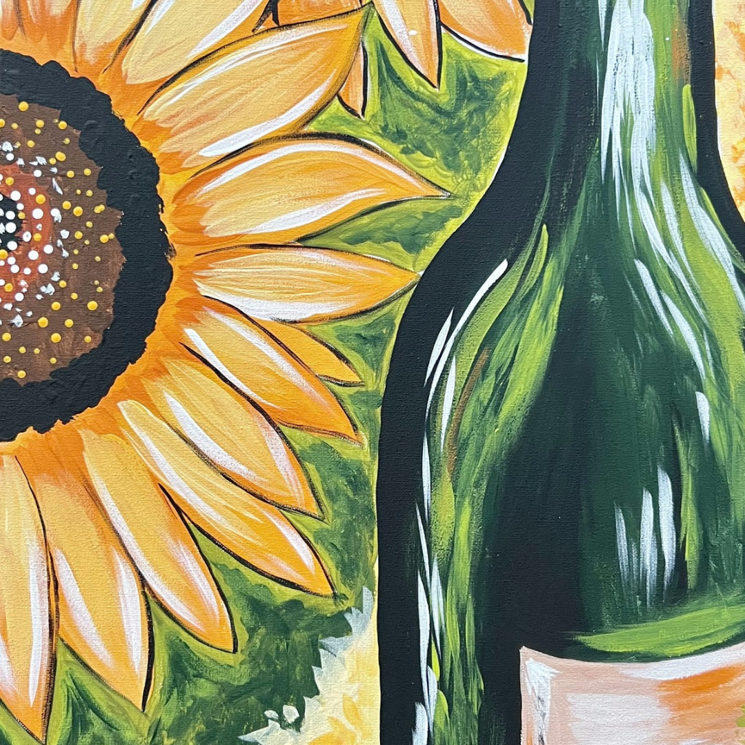 Close-up of a sunflower and a bottle with a floral design