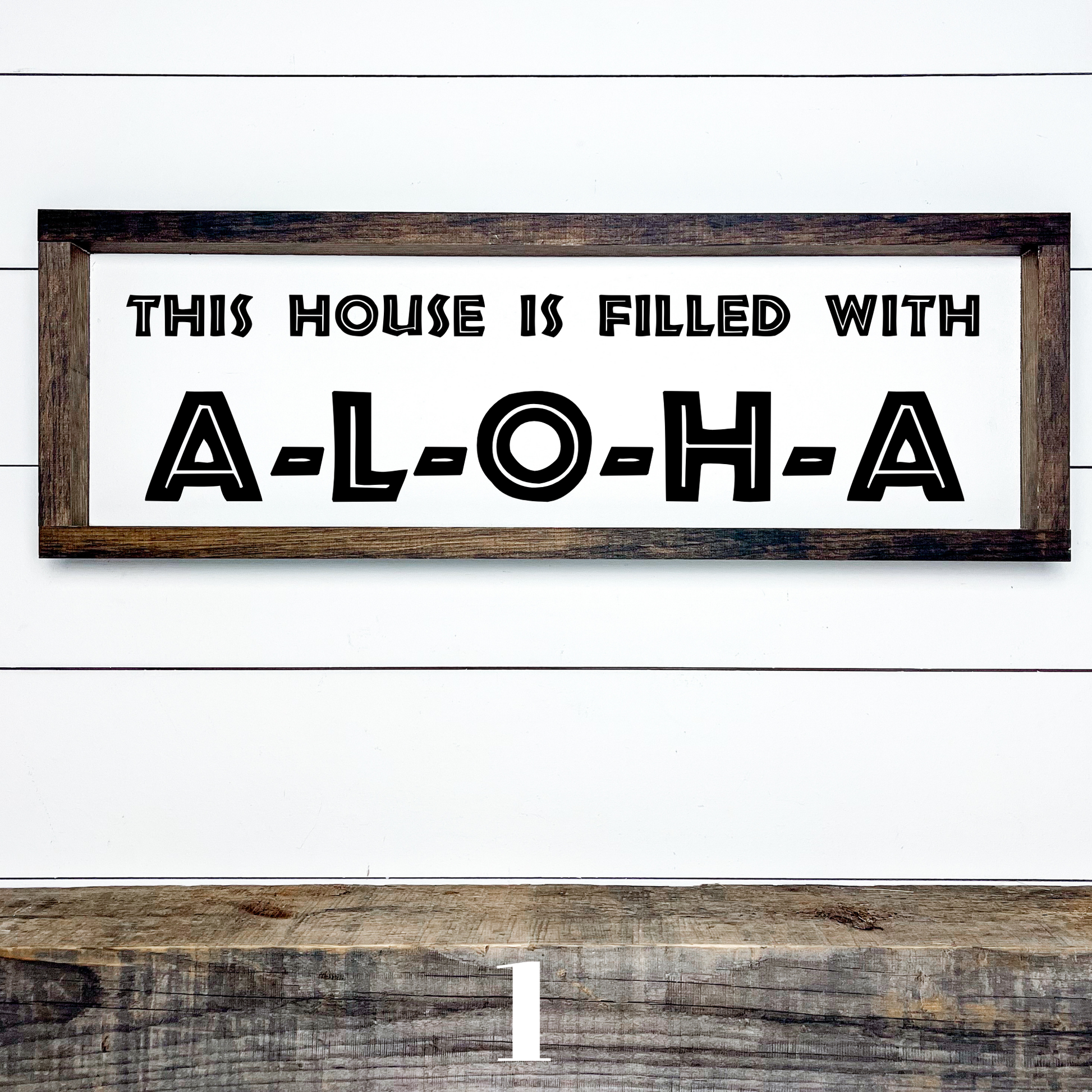 Horizontal wood sign with text "This House is Filled with Aloha" in multiple font styles, handcrafted by Simply Aloha On The Go.