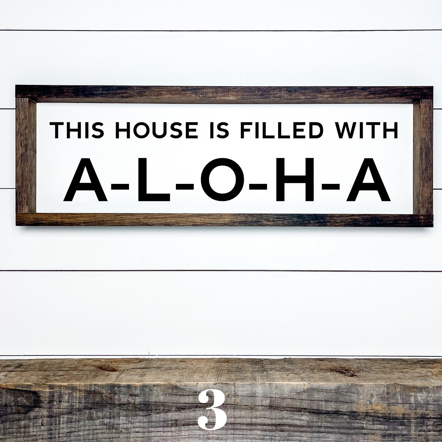 Horizontal wood sign with text "This House is Filled with Aloha" in multiple font styles, handcrafted by Simply Aloha On The Go.