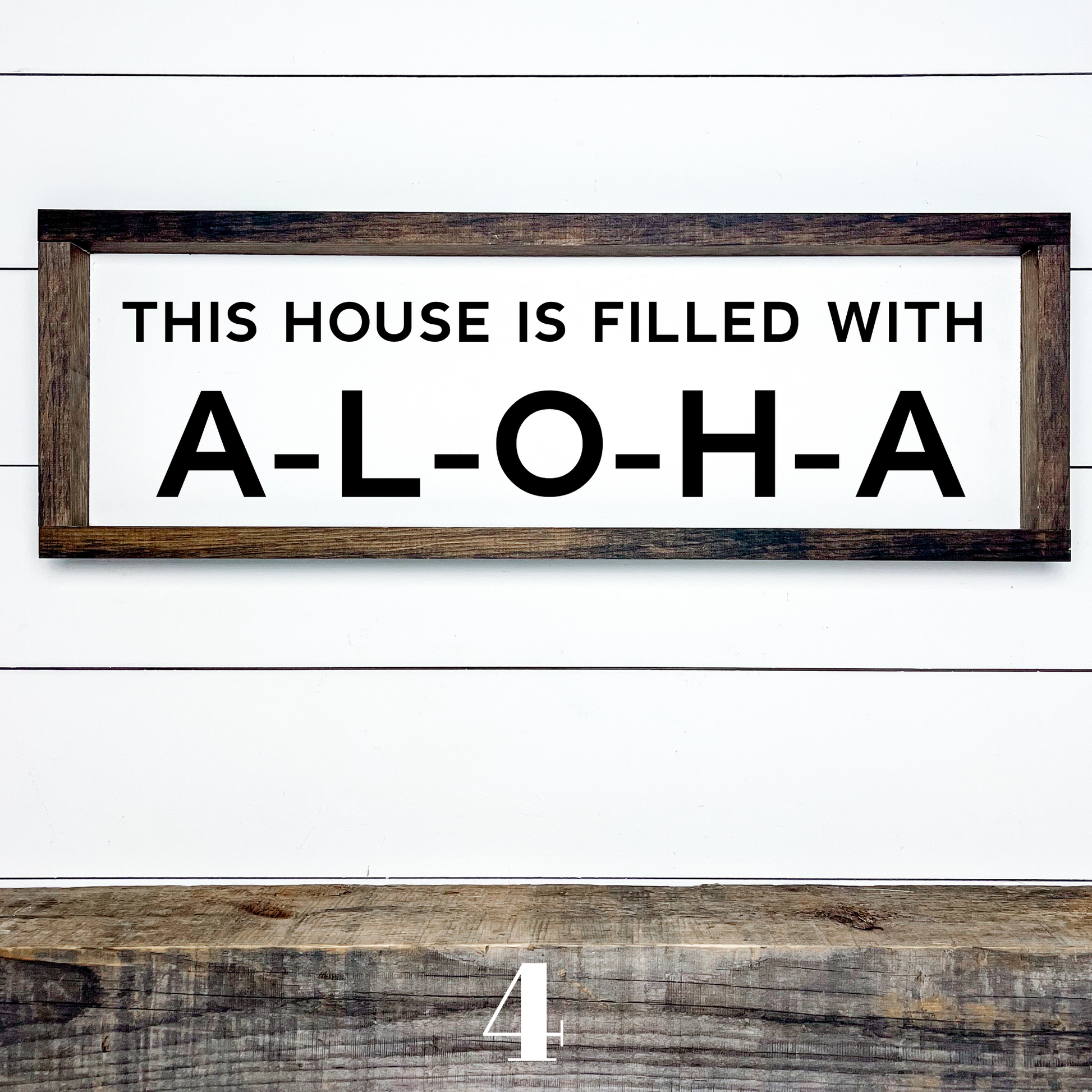 Handcrafted island style wood sign reading “This House Is Filled With Aloha” for tropical home decor