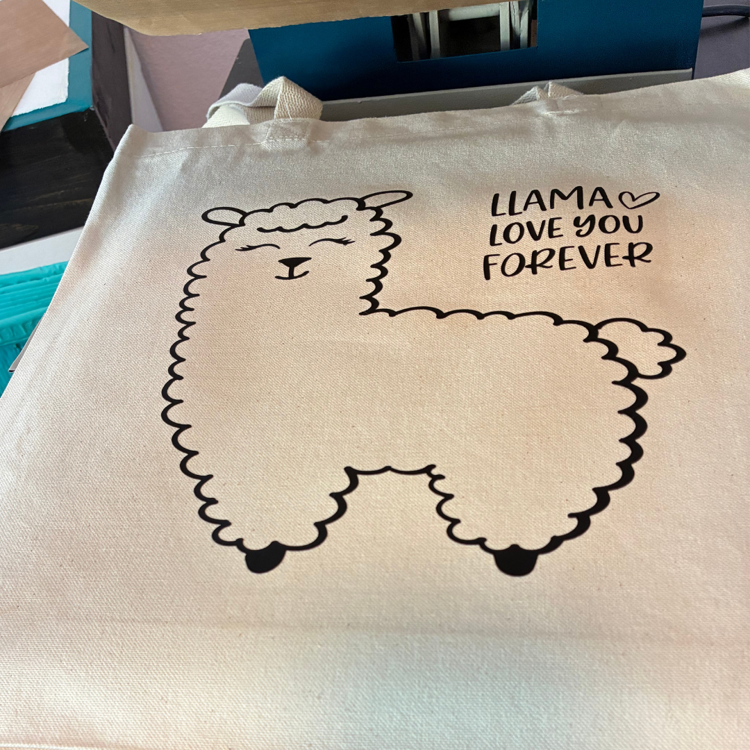 Tote bag with a llama design and text "Llama Love You Forever" 