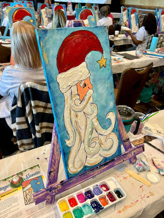  A photo of a Vintage-style Santa Claus with red coat and rosy cheek at a paint party birthday event 