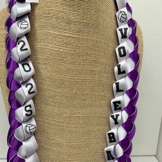 Closeup of a custom volleyball senior night ribbon leis, personalized with athlete's name and jersey number for a unique graduation gift for your player or the entire team! 