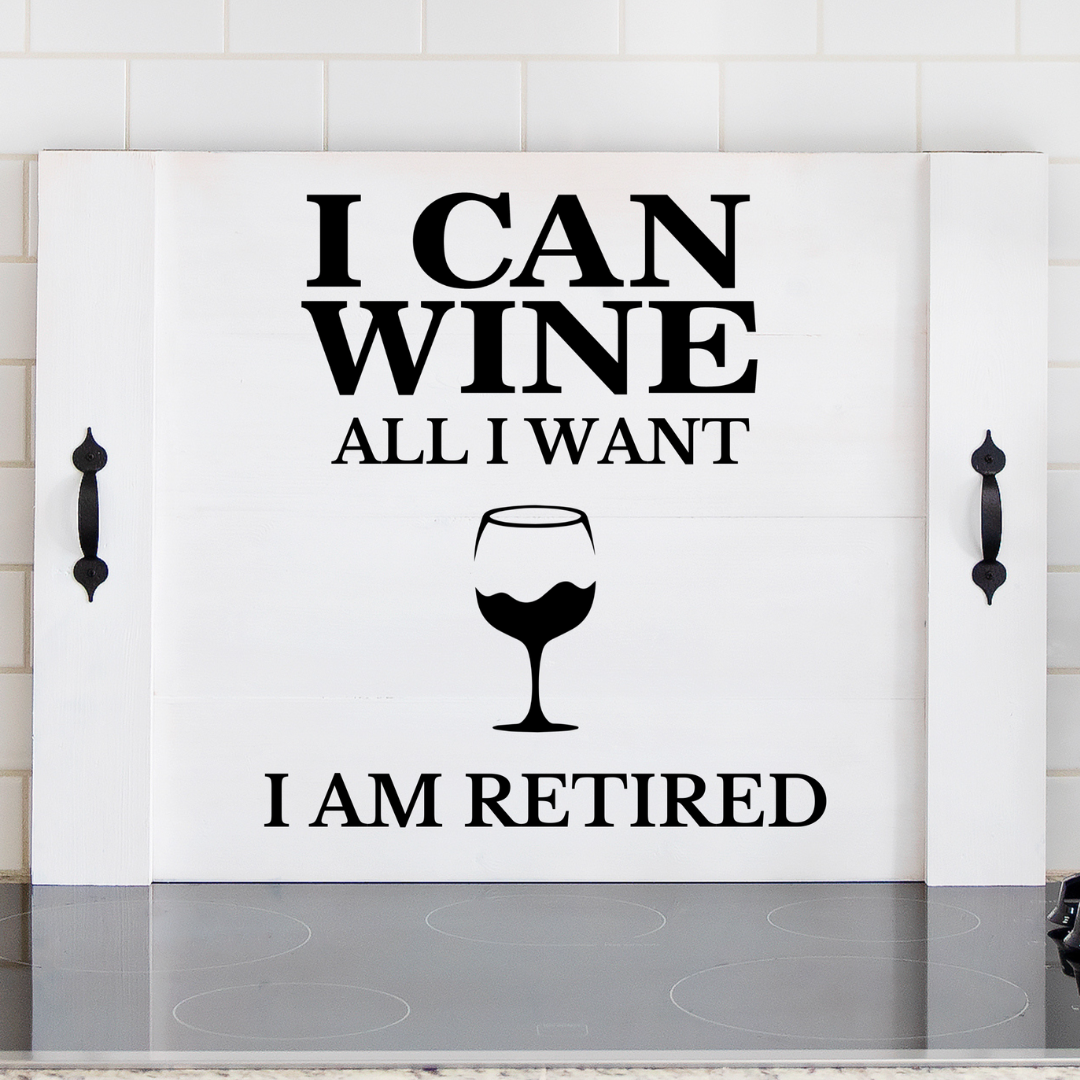 Handcrafted farmhouse noodle board with the phrase "I can wine all I want" and "I am retired" separated by a wine glass graphic in white background and black handles