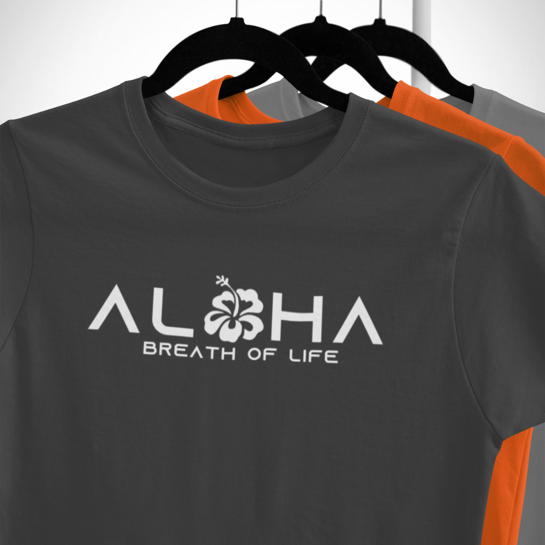 Close up of Women's Aloha Breath of Life t-shirt with white hibiscus flower lettering